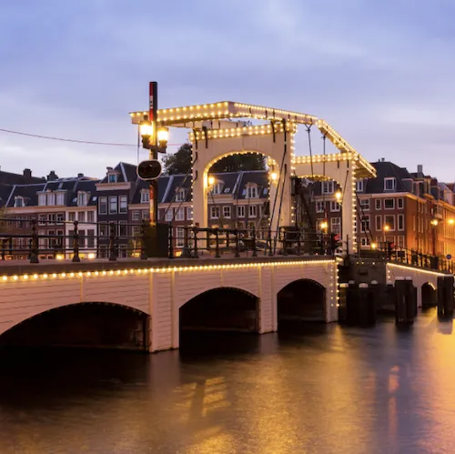 The Skinny Bridge or Magere Brug in Amsterdam at night